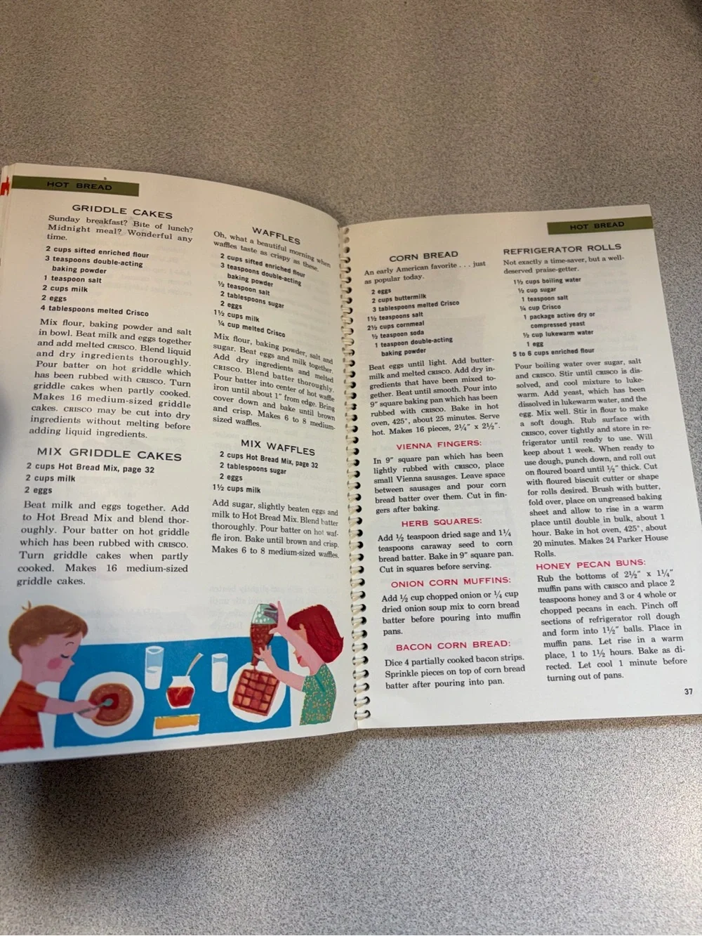 Cisco Cookbook with Bright Blue Cover and Red Polka-Dot Dress Illustration